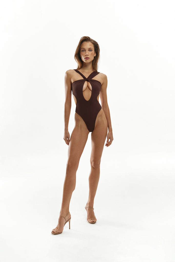 High-cut chocolate silhouette elongating the legs harmoniously.